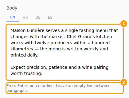 A longer text in two paragraphs, with an empty line between them (1), and the hint below the box (2)