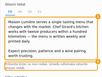 Dulji tekst u dva odlomka, s praznim retkom između njih (1), i savjet ispod okvira (2)